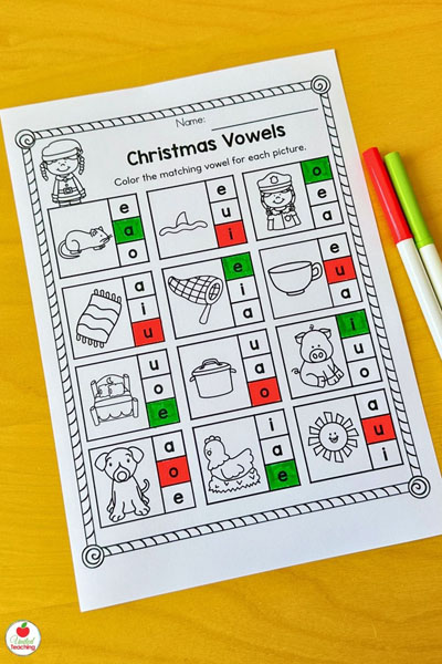 Color the matching missing vowel Christmas worksheet for literacy.