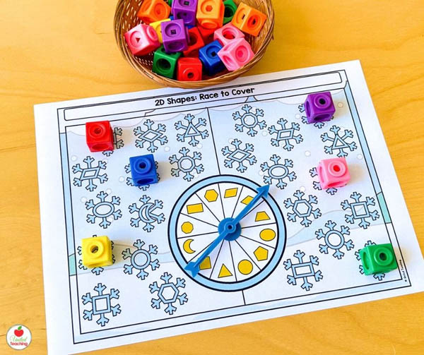 Spin and Race to Cover a Snowflake 2D Shape Winter Math Game