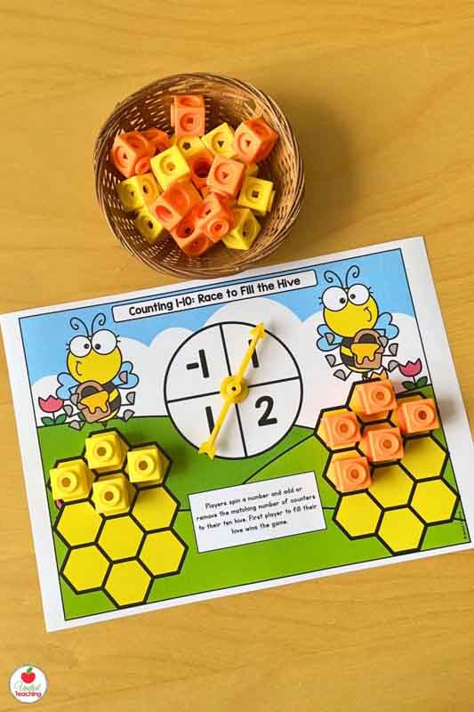 Spin and race to fill a hive with ten spaces partner math game