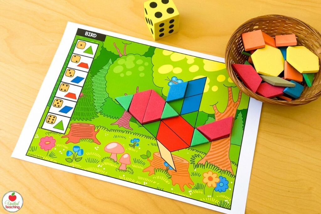 Roll and build bird pattern block mat with a forest scene background, where students roll a die and place the matching shape until the bird is complete