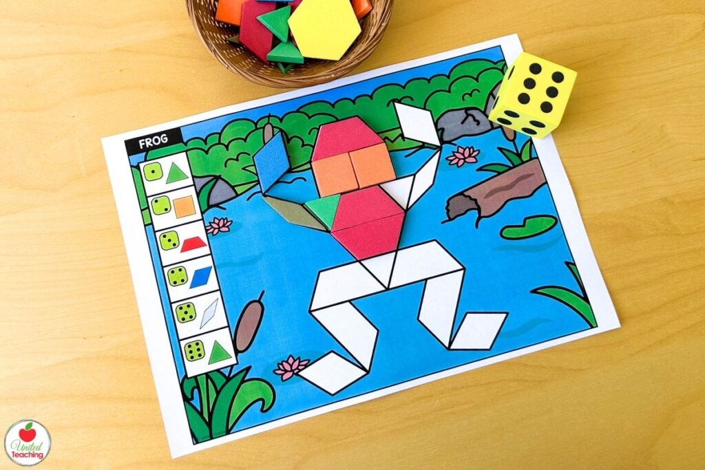 Partially completed roll and build frog pattern block mat with a pond scene, where students roll a die and place the matching shape until the frog is complete