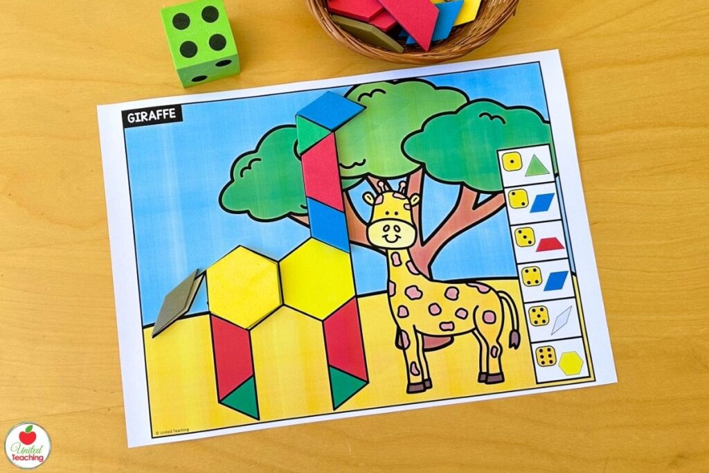 Roll and build giraffe pattern block mat with a safari scene featuring a giraffe and acacia trees, where students roll a die and place the matching shape to build the giraffe