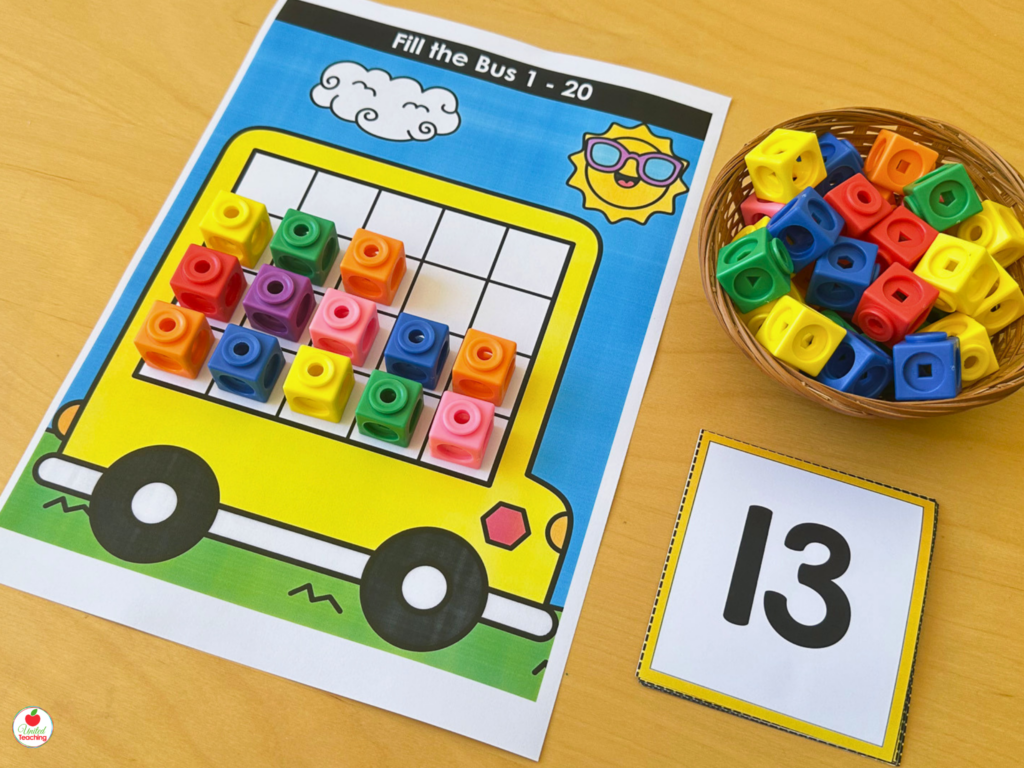 Fill the Bus activity mat for numbers 1-20 showing math cubes filling a double ten-frame bus alongside a number 13 card