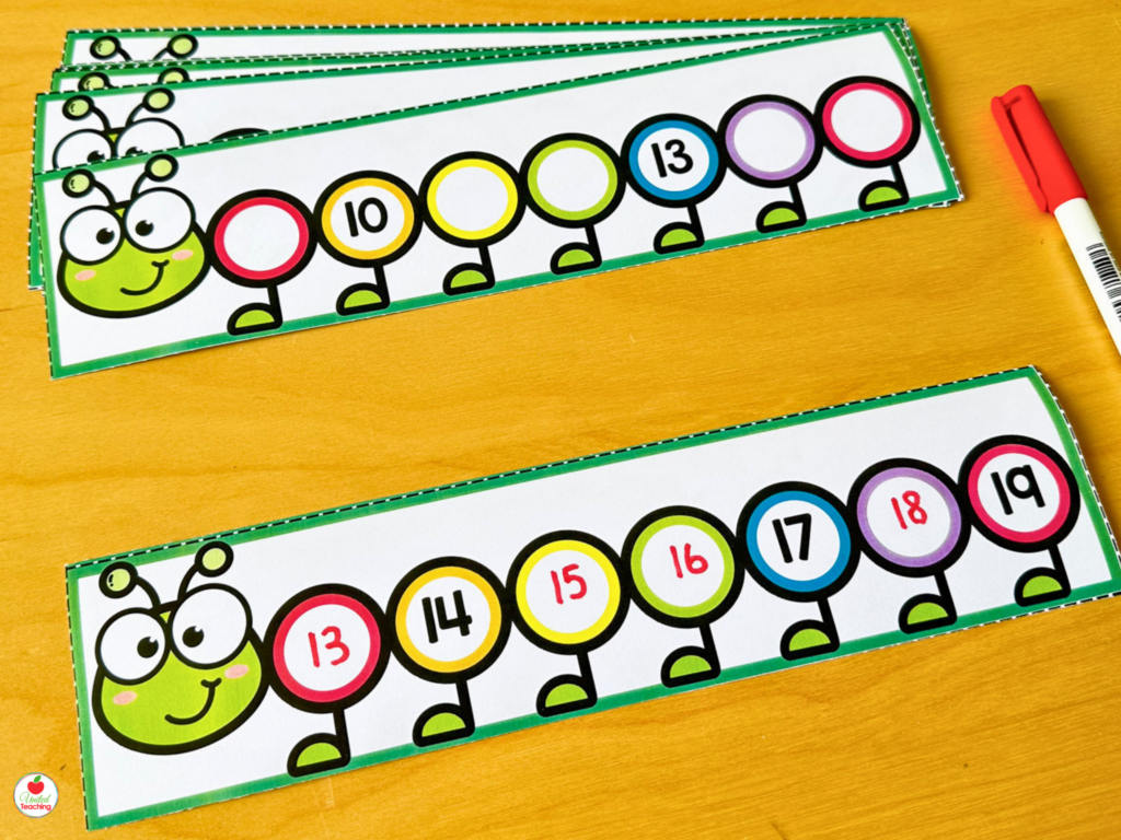 Caterpillar-themed number sequence strips for numbers 11-19 with missing numbers for students to complete using a dry-erase marker