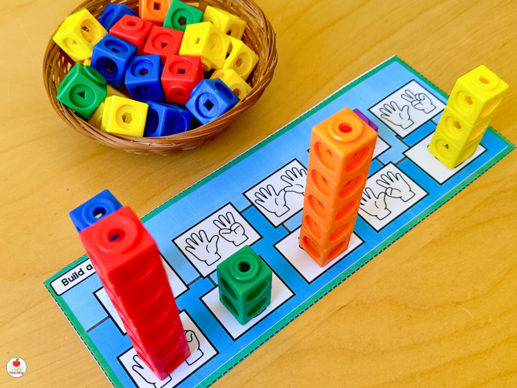 Number sense activity mat with math cube towers of varying heights matched to finger pattern cards for number sense practice