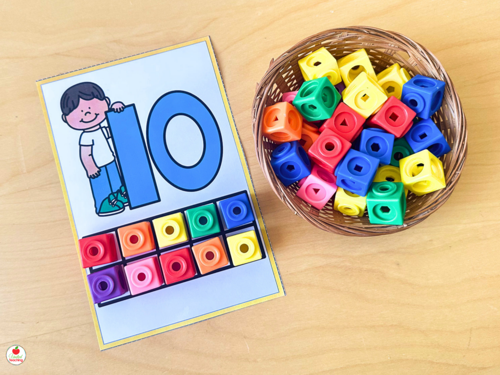 Number sense counting mat for number 10 with math cubes filling a ten-frame grid next to a character number card