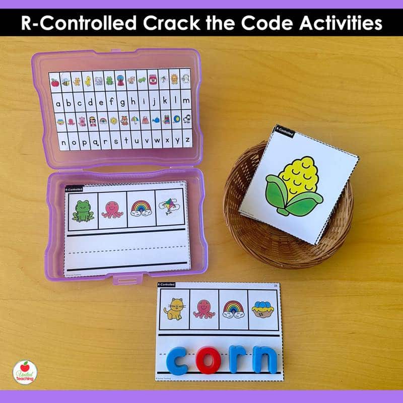 R-Controlled Vowels Crack the Code Task Cards or activity with purple photo box and magnetic letters spelling corn