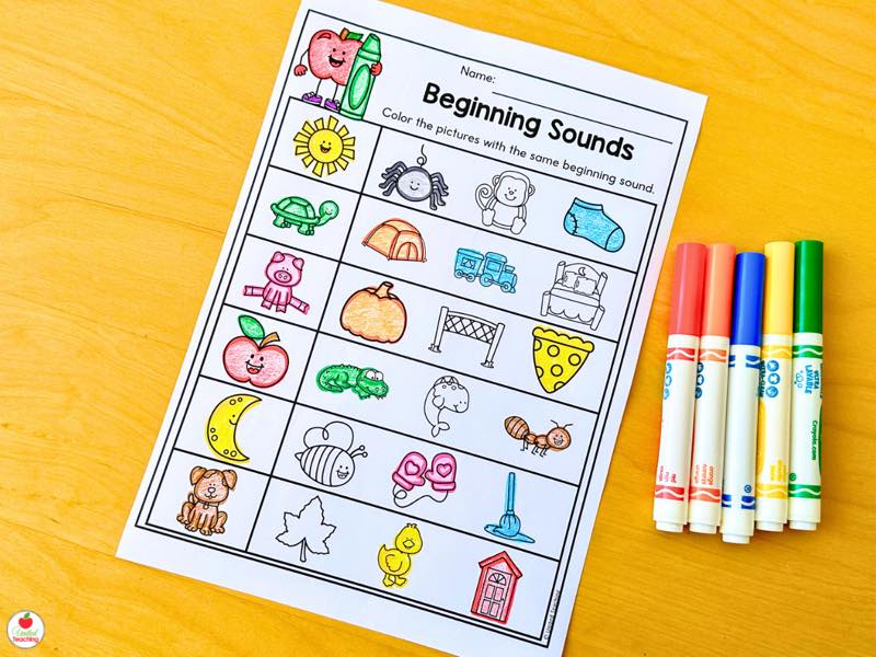 Beginning Sounds worksheet with students coloring pictures that share the same beginning sound