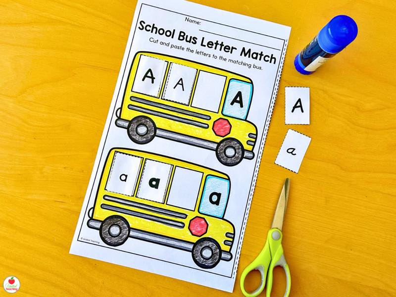 School Bus Letter Match cut and paste worksheet with loose uppercase and lowercase A letter pieces