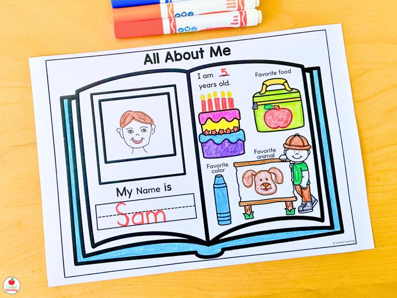 Kindergarten student worksheet cutting and pasting uppercase and lowercase A letters onto matching school buses