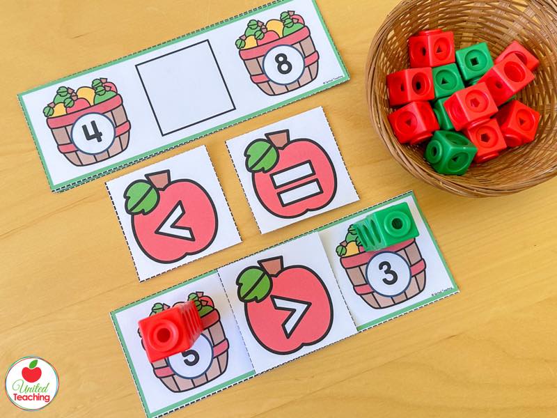 Apple build and compare task cards with basket numbers 4 and 8 and greater than less than symbol cards