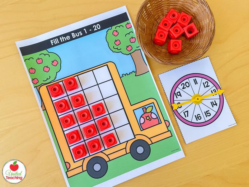 Apple Fill the Bus ten frame mat for numbers 1 to 20 with red math cubes and an 11 to 20 spinner