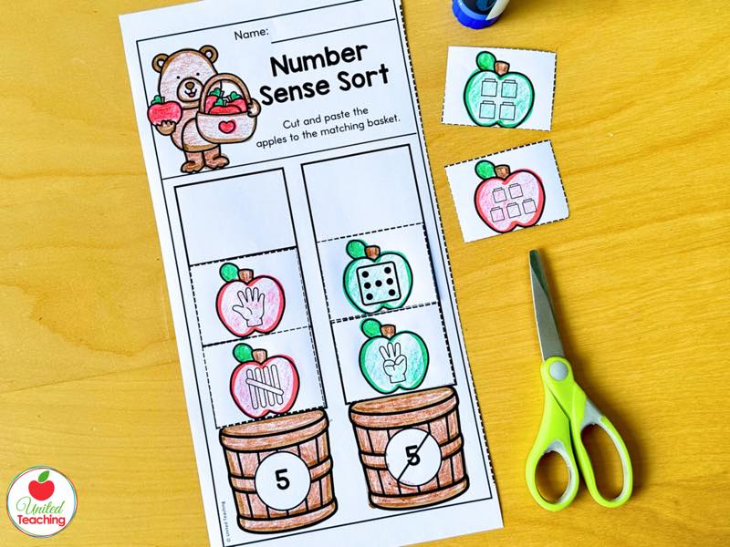 Apple Number Sense Sort cut and paste worksheet with apple number forms sorted onto matching baskets