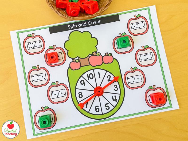 Apple Spin and Cover mat for 1 to 10 with domino apples and red and green math cubes
