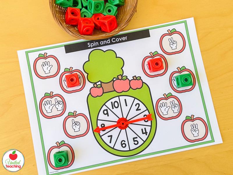 Apple Spin and Cover mat for 1 to 10 with finger counting apples and red and green math cubes