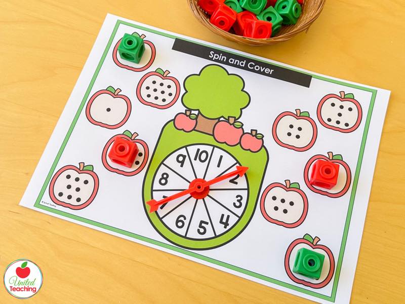 Apple Spin and Cover mat for 1 to 10 with subitizing dot apples and red and green math cubes