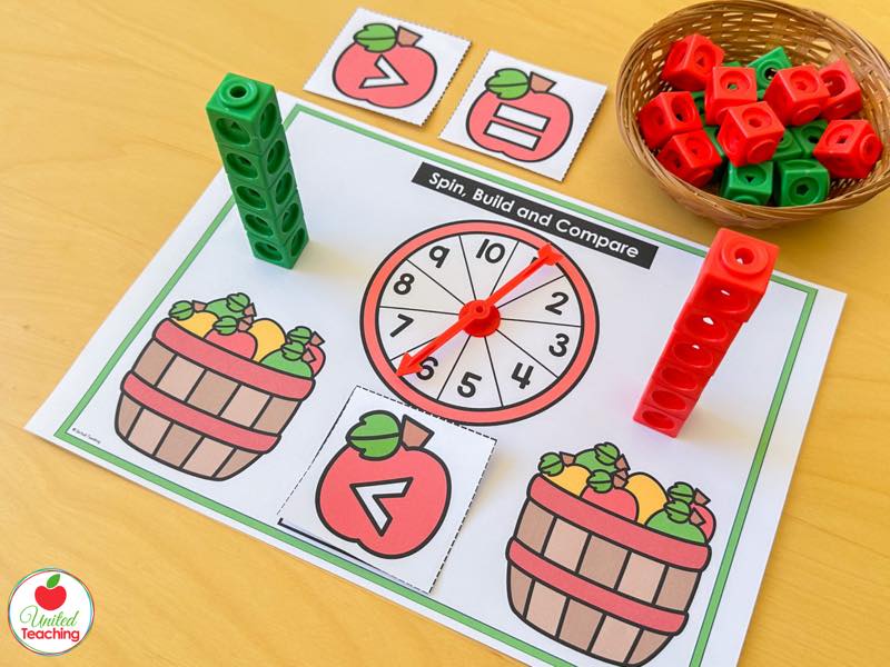 Apple Spin Build and Compare mat with apple baskets, a 1 to 10 spinner and math cube towers