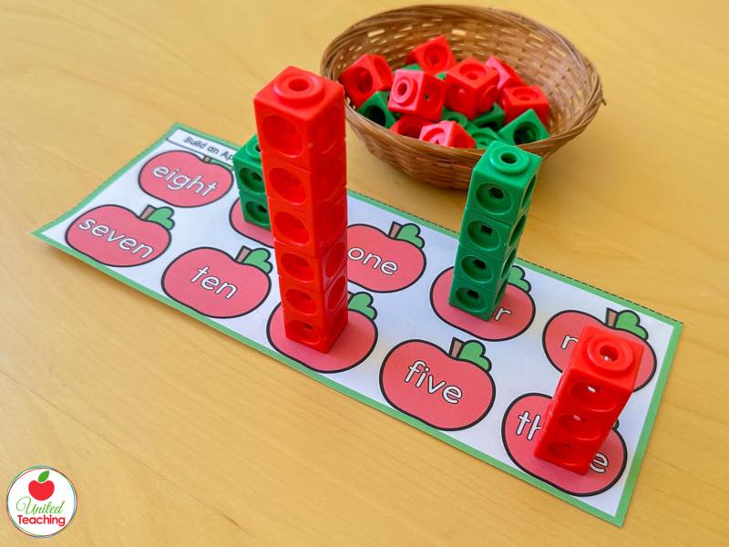 Apple tower mat with number word apples and red and green math cube towers built to match