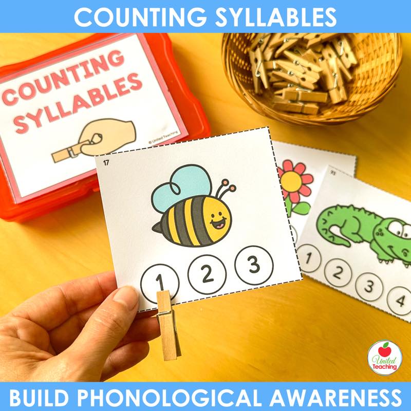 Counting syllables clip cards in a red storage box with clothespins for a kindergarten literacy center