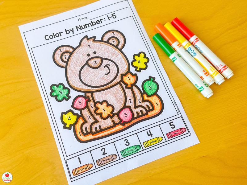 Fall color by number 1-5 worksheet for kindergarten with a bear and leaves colored in with markers