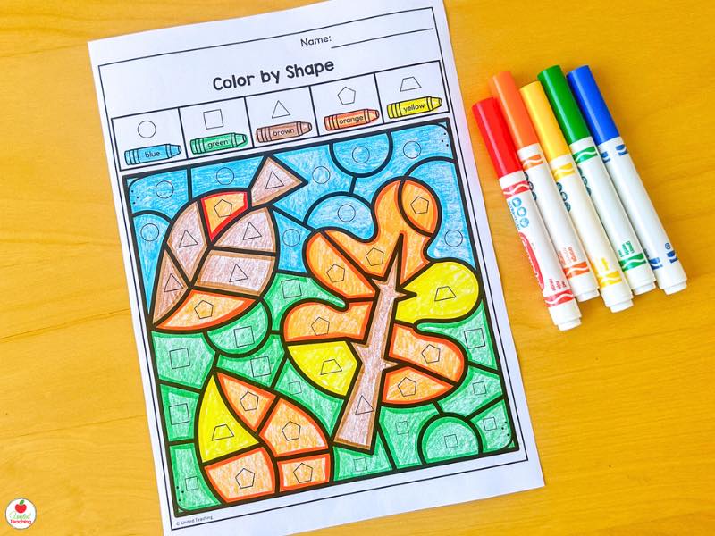 Fall color by shape 2D shapes worksheet for kindergarten with a colored leaf picture