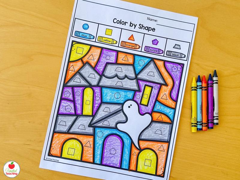 Halloween color by shape worksheet for kindergarten with a colored haunted house and ghost