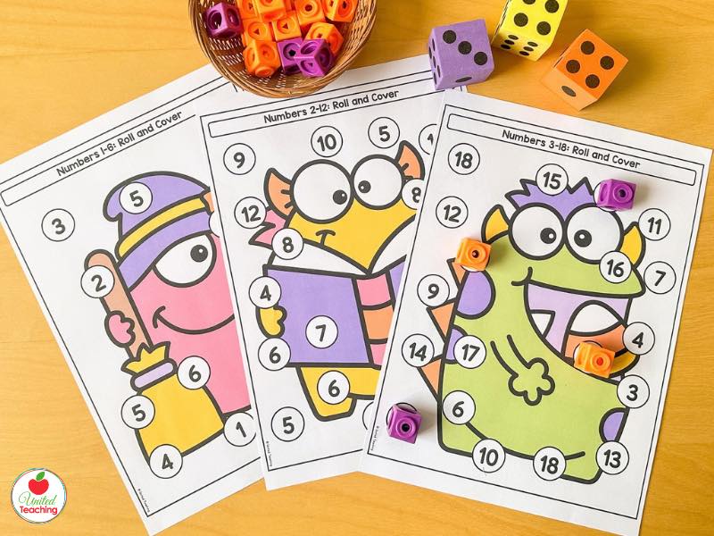 Three Halloween Roll and Cover math boards for numbers 1-6, 2-12, and 3-18 with dice and snap cubes