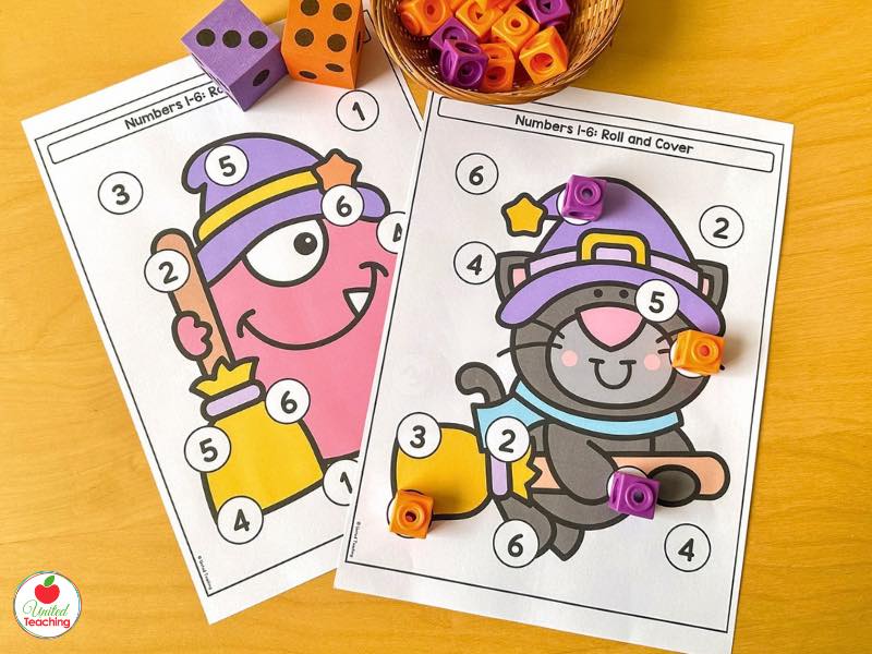 Two Halloween Roll and Cover numbers 1-6 math boards with a witch monster and cat, dice, and snap cubes