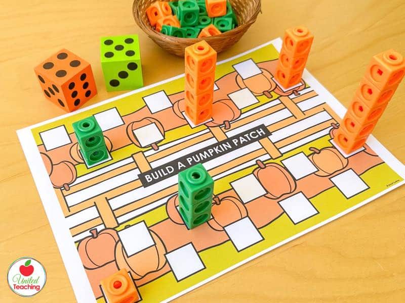 Build a Pumpkin Patch partner game board with two dice and orange and green math cube towers