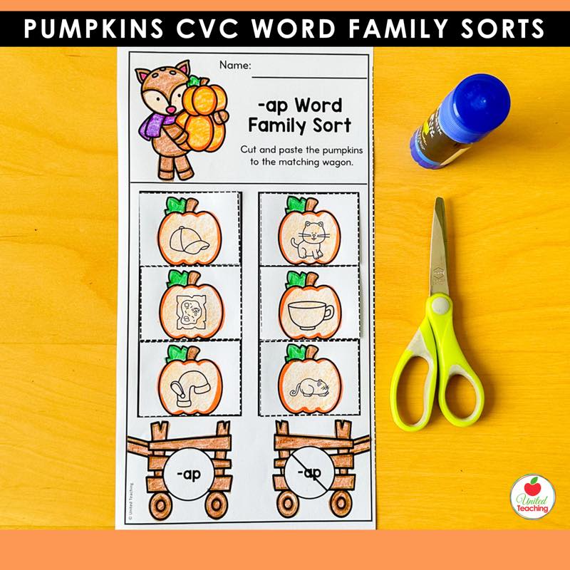 Pumpkins -ap word family sorting worksheet with pumpkin picture cards and wagons, scissors and glue on a desk