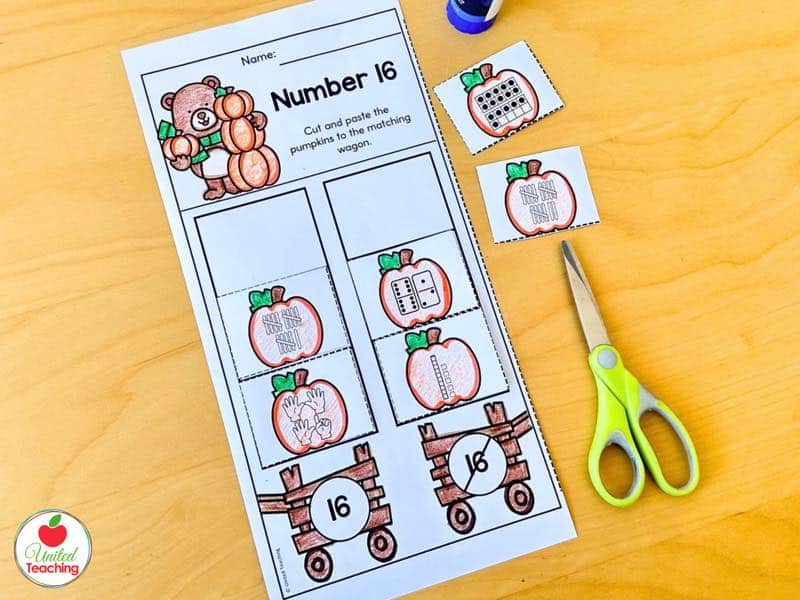Pumpkin number sense sorting cut and paste worksheet for number 16 with number forms and matching wagons