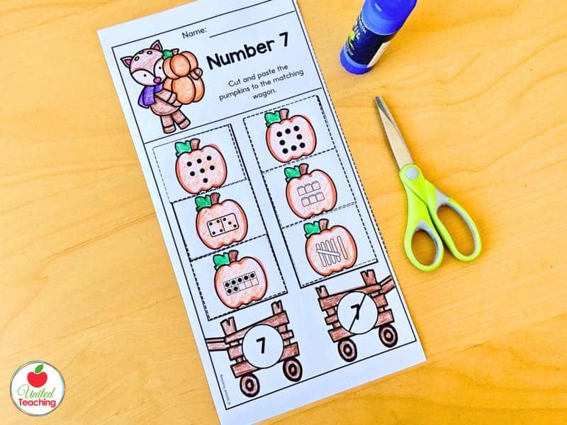 Pumpkin number sense sorting cut and paste worksheet for number 7 with number forms sorted onto wagons
