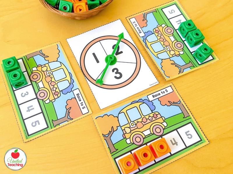 Pumpkin Race to 5 bus game boards with a 1 to 3 spinner and orange and green math cubes