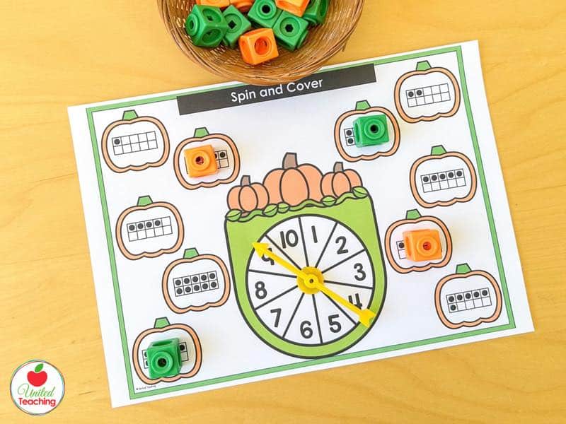 Pumpkin Spin and Cover mat for 1 to 10 with ten frame pumpkins and orange and green math cubes