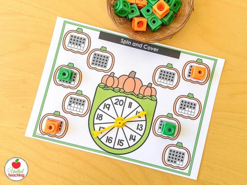Pumpkin Spin and Cover mat for 11 to 20 with double ten frame pumpkins and orange and green math cubes