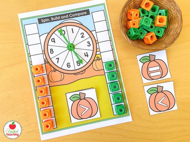 Pumpkin Spin Build and Compare mat with a 1 to 10 spinner, cube columns, and a greater than pumpkin card