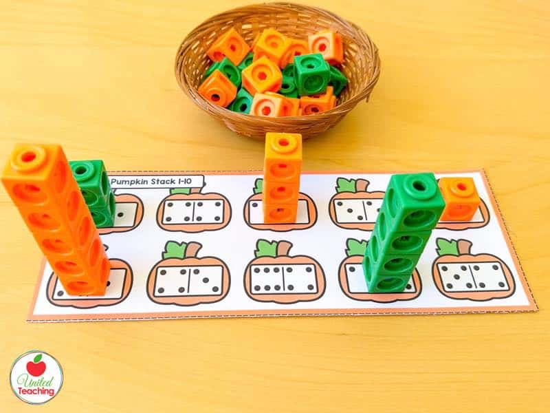 Build a Pumpkin Stack mat with domino pumpkins and orange and green math cube towers built to match