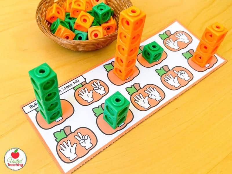 Build a Pumpkin Stack mat with finger counting pumpkins and orange and green math cube towers