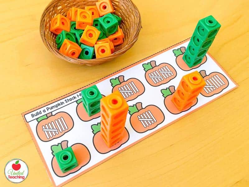 Build a Pumpkin Stack mat with tally mark pumpkins and orange and green math cube towers built to match