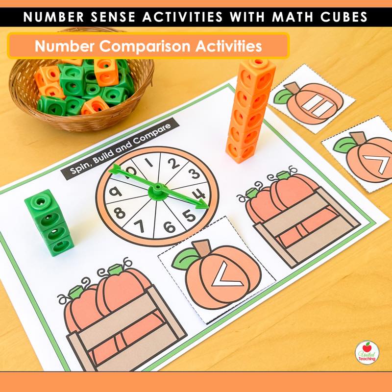 Spin, Build and Compare mat with a math cube tower and pumpkin greater than less than cards
