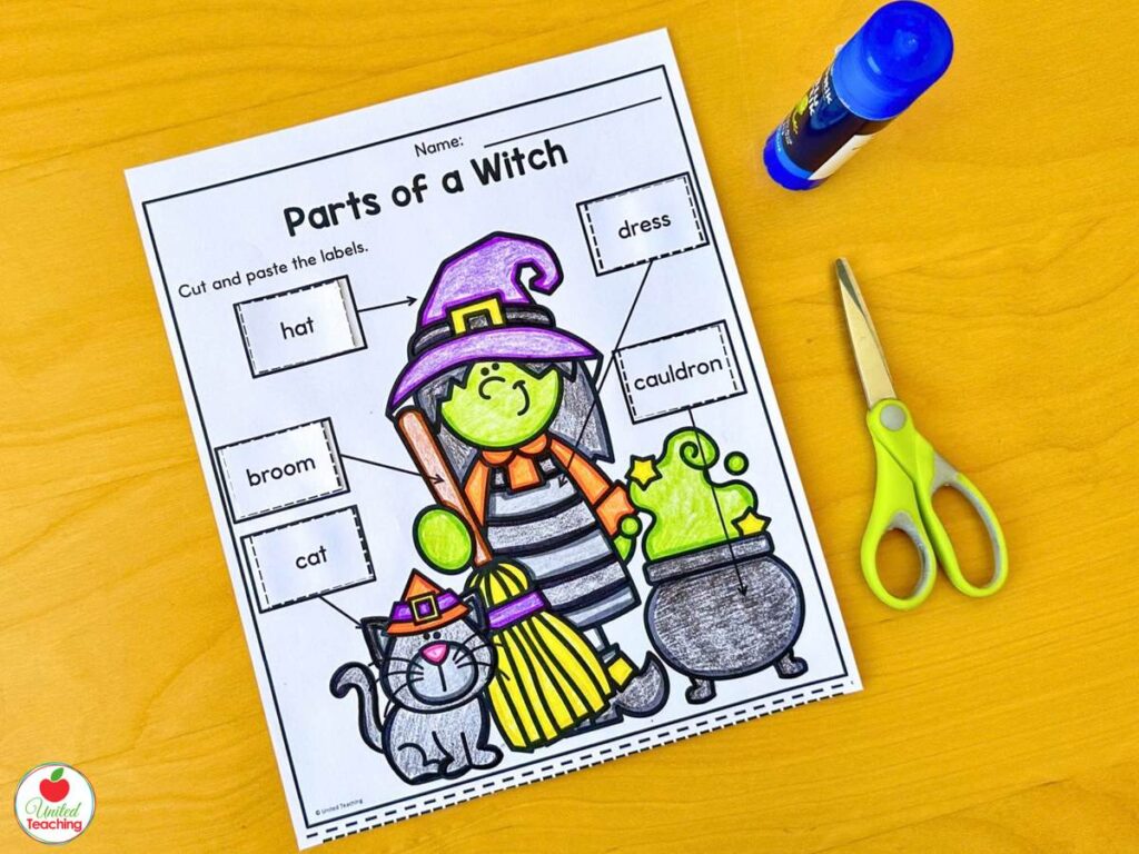 Parts of a Witch Halloween cut and paste labeling worksheet with hat, broom, cat, dress, and cauldron
