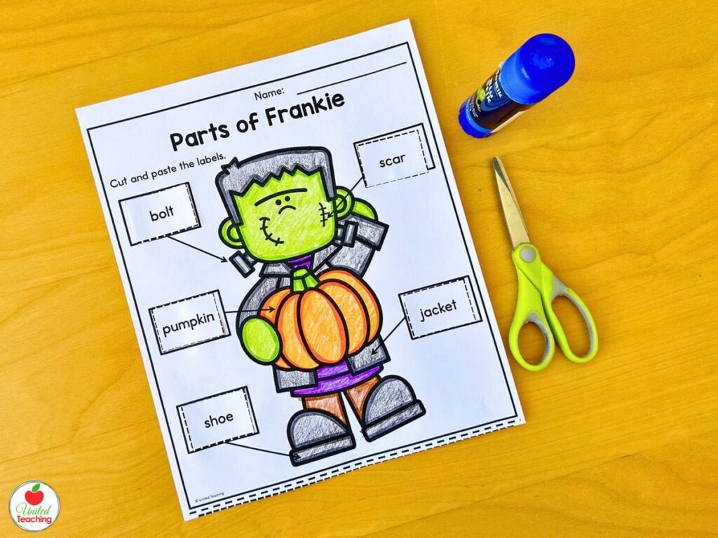 Parts of Frankie Halloween cut and paste labeling worksheet with bolt, scar, pumpkin, jacket, and shoe