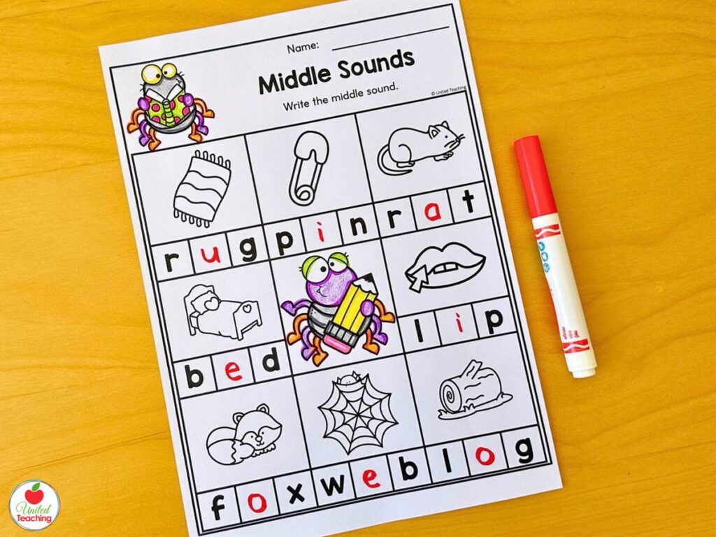 Halloween middle sounds worksheet with a spider, write the middle vowel sound for each CVC picture