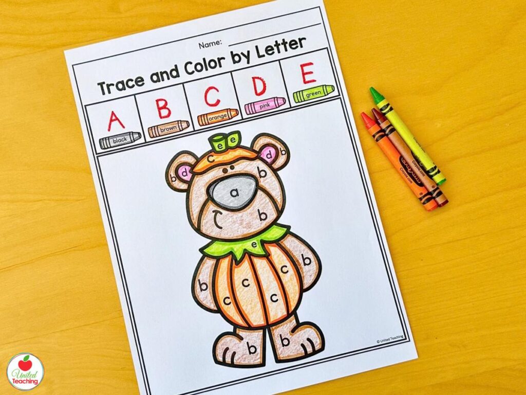 Halloween trace and color by letter worksheet for letters A to E with a bear in a pumpkin costume